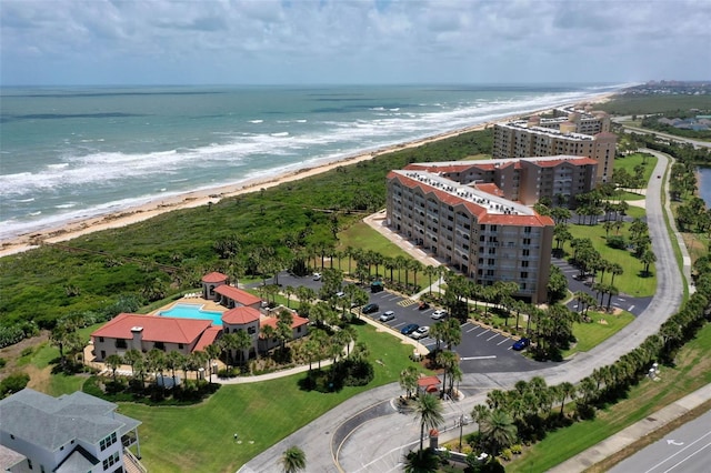 aerial view with a water view and a view of the beach