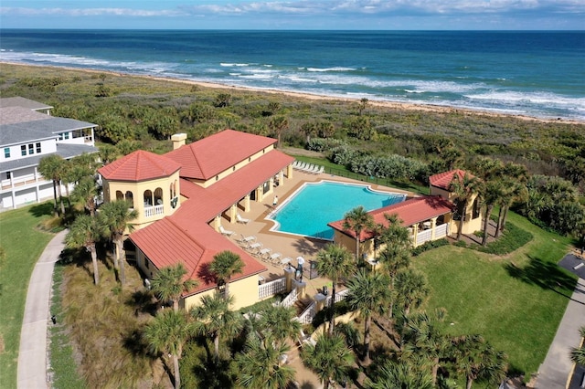 aerial view with a water view and a beach view