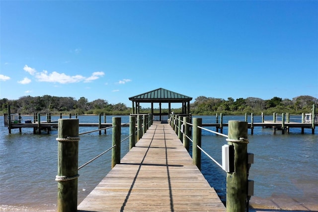 dock area with a gazebo and a water view