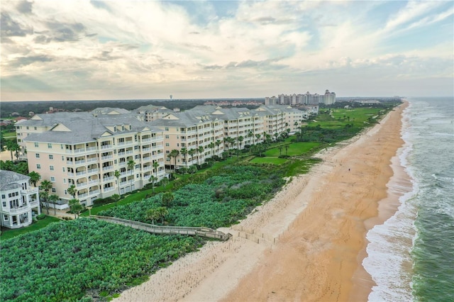 bird's eye view featuring a water view and a view of the beach