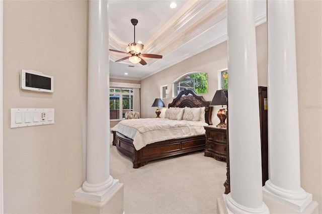 carpeted bedroom with ornate columns, ceiling fan, and ornamental molding