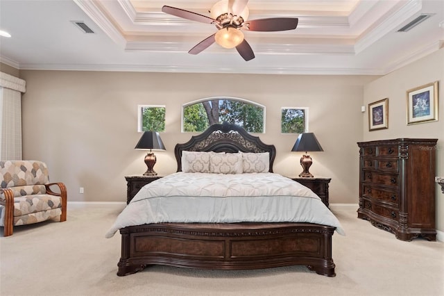 bedroom featuring light carpet, a raised ceiling, ceiling fan, and ornamental molding