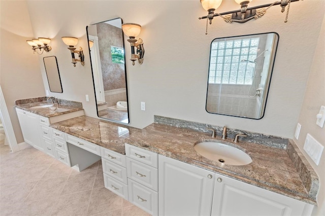 bathroom featuring tile patterned flooring and vanity