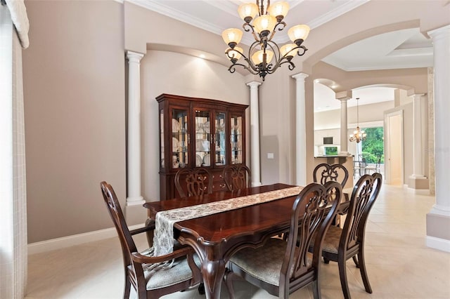 dining room with light tile patterned floors, crown molding, and a chandelier