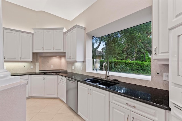 kitchen with white cabinets, sink, and a wealth of natural light