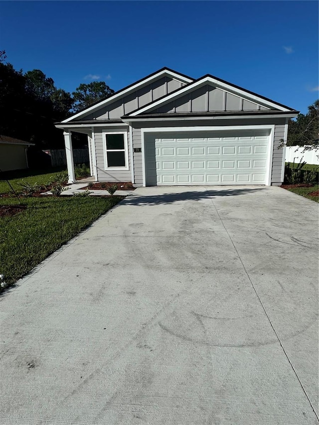 ranch-style home featuring a garage