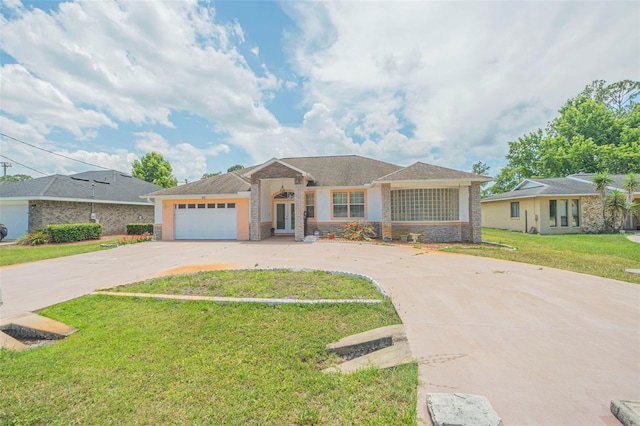 ranch-style home with a front yard and a garage