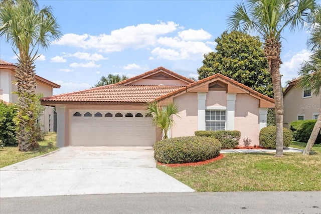 mediterranean / spanish-style home featuring a garage and a front lawn