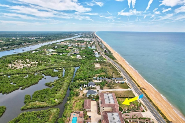 birds eye view of property featuring a water view and a view of the beach