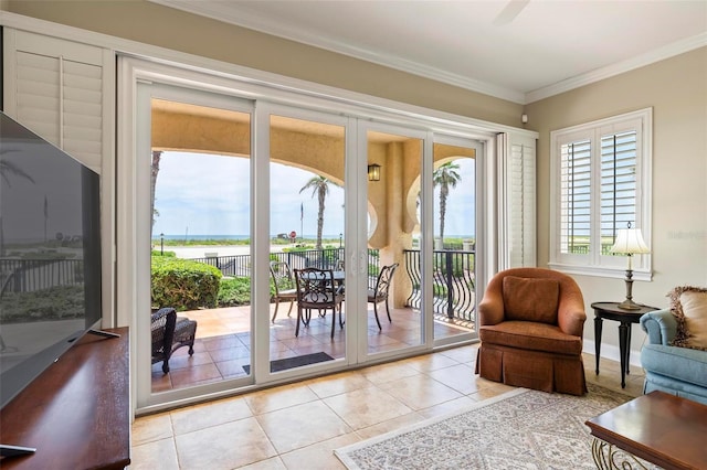 doorway to outside featuring ceiling fan, crown molding, and light tile patterned flooring