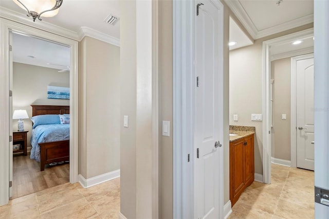 bathroom with vanity, wood-type flooring, and ornamental molding