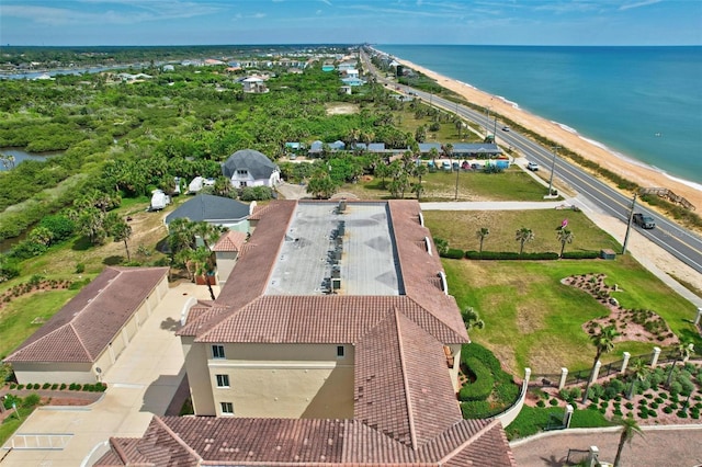 drone / aerial view with a water view and a view of the beach