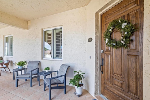 property entrance featuring a porch