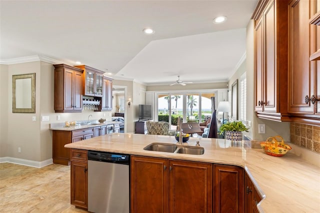 kitchen with ceiling fan, dishwasher, sink, kitchen peninsula, and ornamental molding