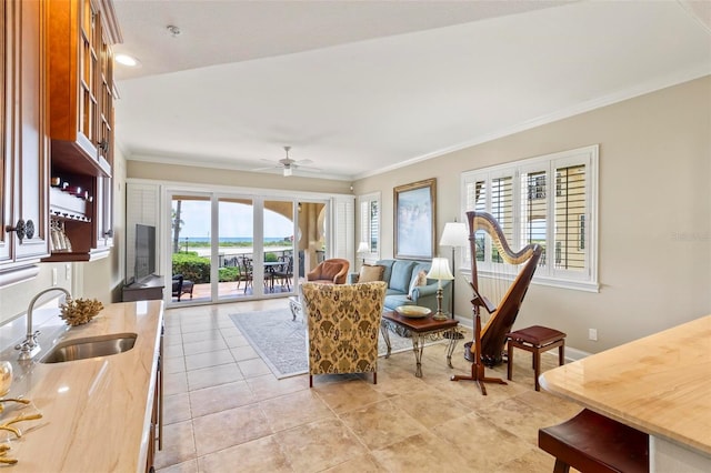 living room featuring french doors, crown molding, sink, ceiling fan, and light tile patterned floors