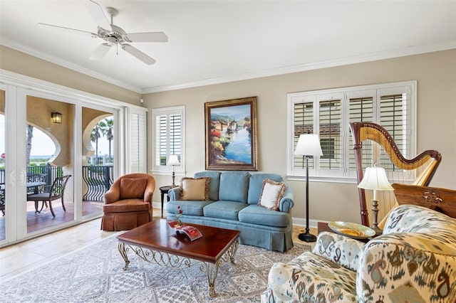 living room with light tile patterned floors, ceiling fan, and ornamental molding