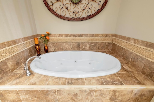 bathroom featuring tiled tub