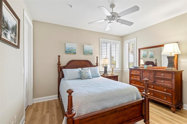 bedroom with ceiling fan and light hardwood / wood-style flooring