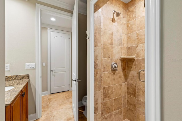 bathroom with toilet, vanity, and walk in shower