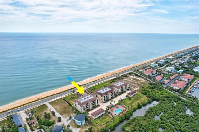 aerial view with a water view and a view of the beach