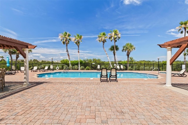 view of pool featuring a pergola and a patio