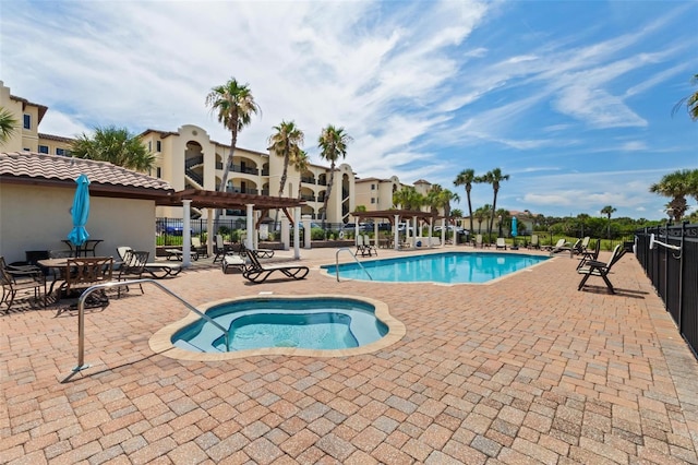 view of swimming pool featuring a patio area and a pergola