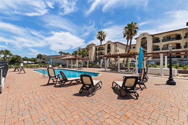 view of swimming pool with a pergola