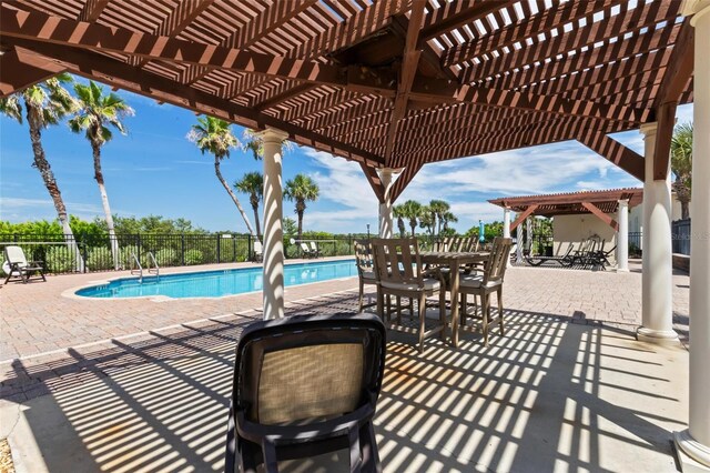 view of swimming pool with a pergola and a patio area