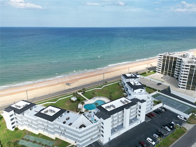 drone / aerial view featuring a view of the beach and a water view