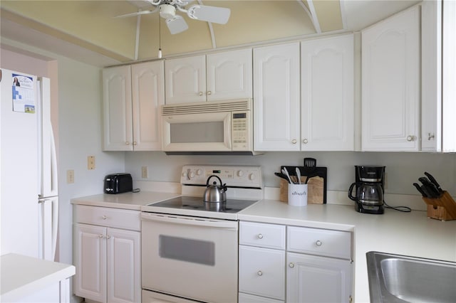 kitchen featuring ceiling fan, white cabinets, and white appliances