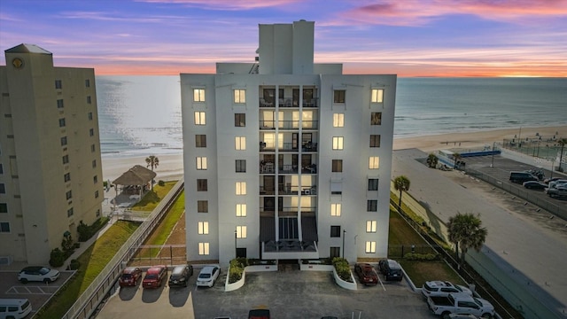 outdoor building at dusk with a view of the beach and a water view