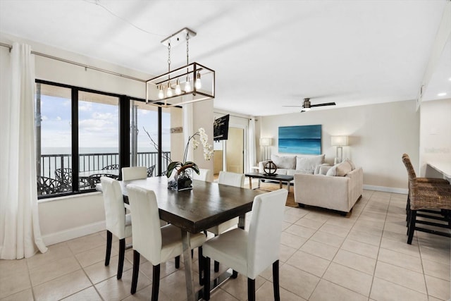 tiled dining space with ceiling fan