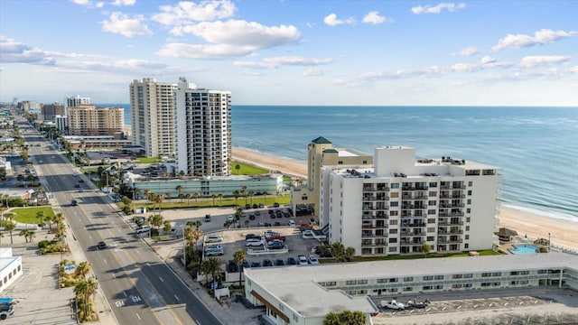 aerial view featuring a water view and a view of the beach