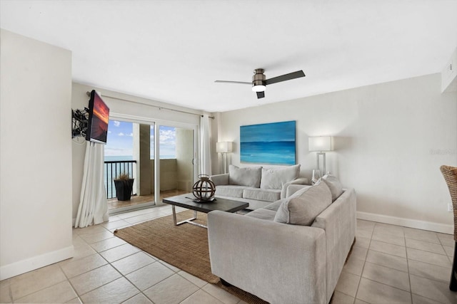 tiled living room with ceiling fan