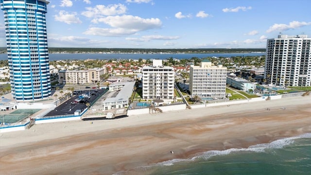 bird's eye view featuring a water view and a view of the beach