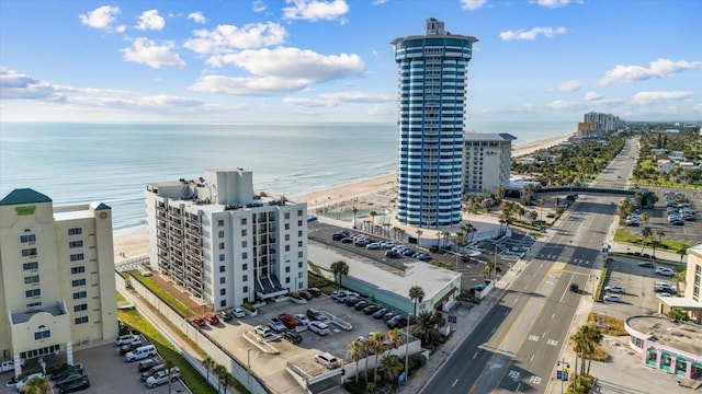 aerial view with a water view and a view of the beach