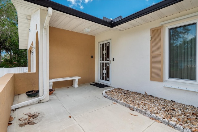 property entrance with a patio area