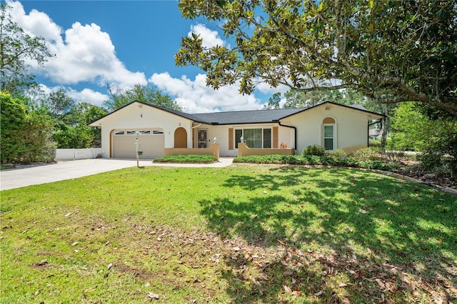 ranch-style home with a front lawn and a garage