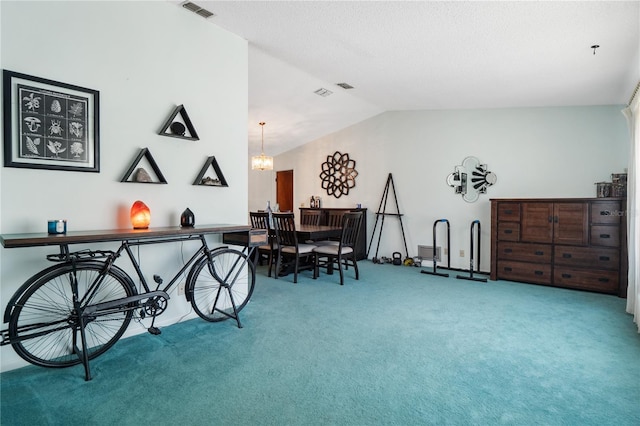 interior space with vaulted ceiling, a notable chandelier, and carpet flooring