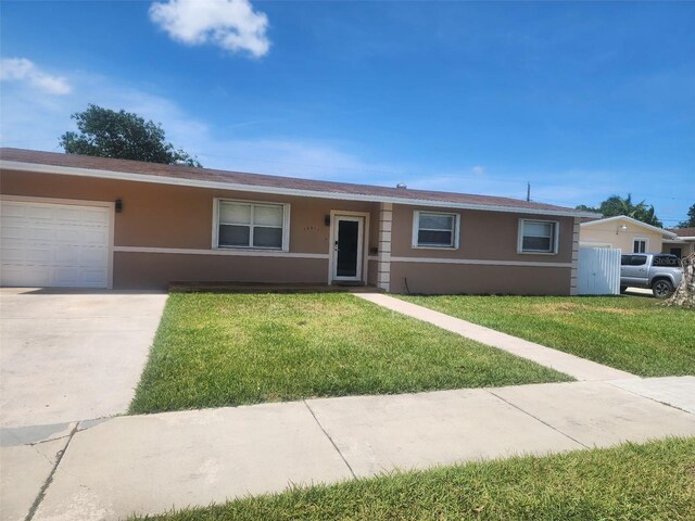 10611 SW 164th St, Miami, FL 33157 - ranch-style house featuring stucco siding, a front lawn, and a garage