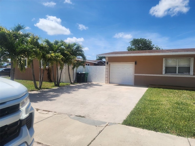 10611 SW 164th St, Miami, FL 33157 - view of front of house featuring an attached garage, stucco siding, and driveway