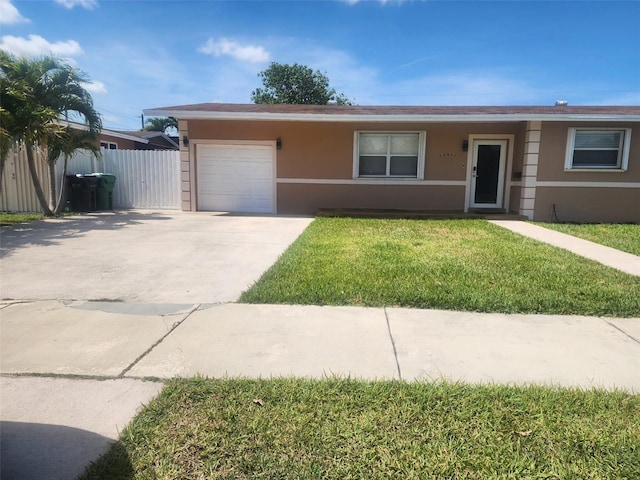 10611 SW 164th St, Miami, FL 33157 - ranch-style home with stucco siding, an attached garage, and concrete driveway