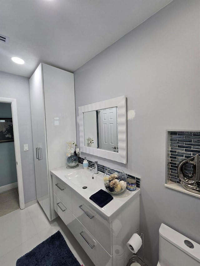 10611 SW 164th St, Miami, FL 33157 - bathroom featuring vanity, toilet, tile patterned flooring, and baseboards