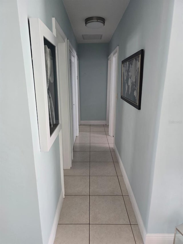 10611 SW 164th St, Miami, FL 33157 - hall featuring light tile patterned floors and baseboards