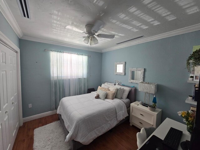 10611 SW 164th St, Miami, FL 33157 - bedroom featuring wood finished floors, ornamental molding, baseboards, ceiling fan, and a closet