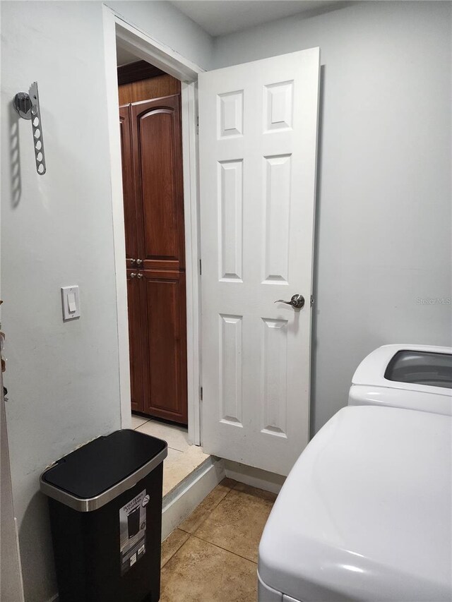 10611 SW 164th St, Miami, FL 33157 - laundry area with light tile patterned flooring