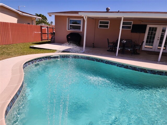 10611 SW 164th St, Miami, FL 33157 - view of pool featuring french doors and a patio area