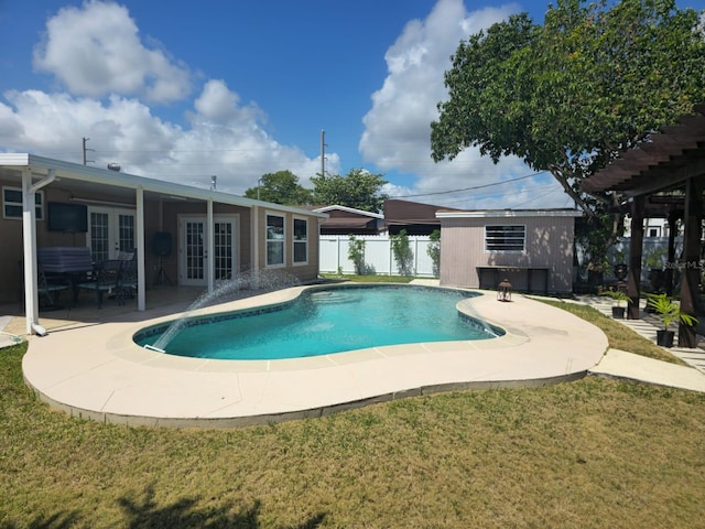 10611 SW 164th St, Miami, FL 33157 - view of swimming pool featuring french doors, a patio area, and an outdoor structure