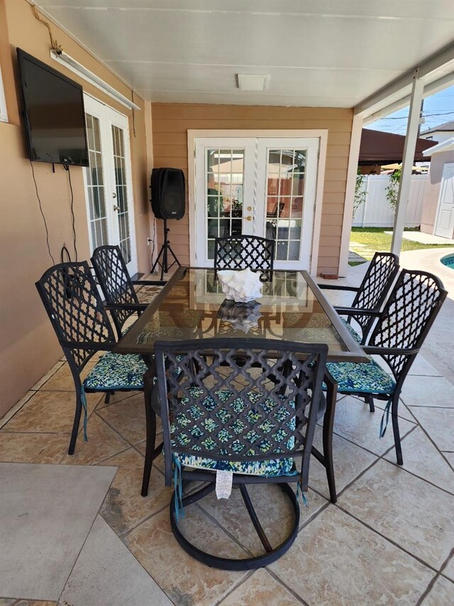 10611 SW 164th St, Miami, FL 33157 - view of patio featuring french doors and outdoor dining area