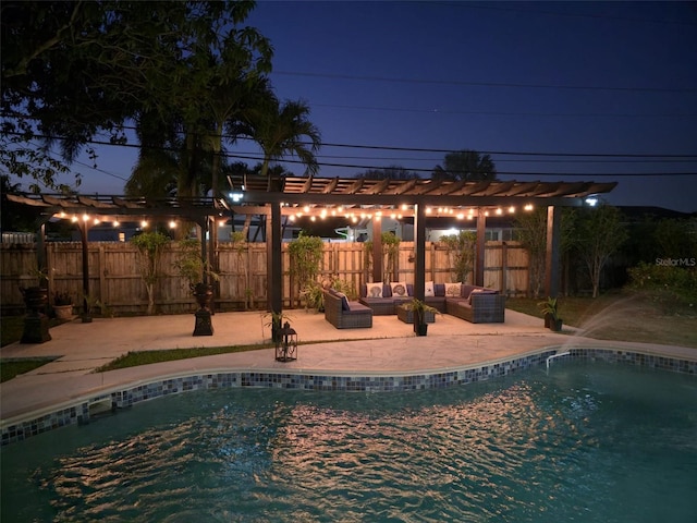 10611 SW 164th St, Miami, FL 33157 - pool at night with a pergola, a patio, and a fenced backyard